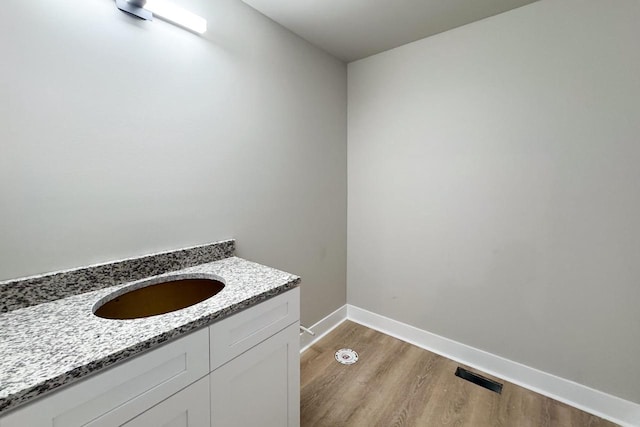 bathroom featuring sink and hardwood / wood-style flooring