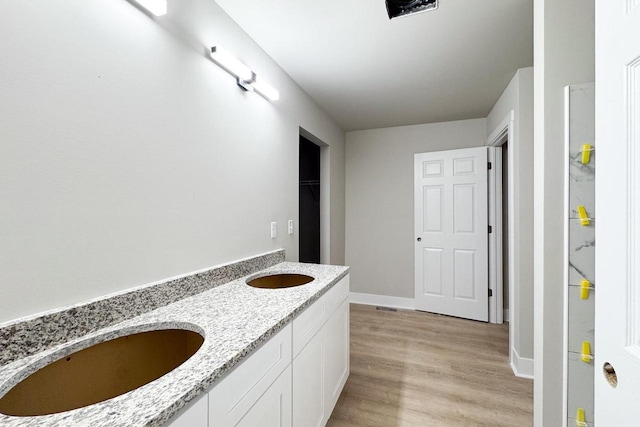 bathroom featuring vanity and hardwood / wood-style flooring