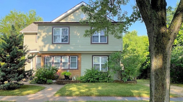 front facade with a front yard