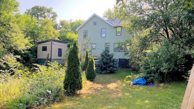 back of house featuring a yard