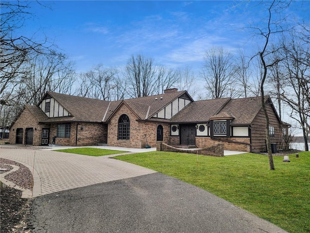 tudor house with a front lawn