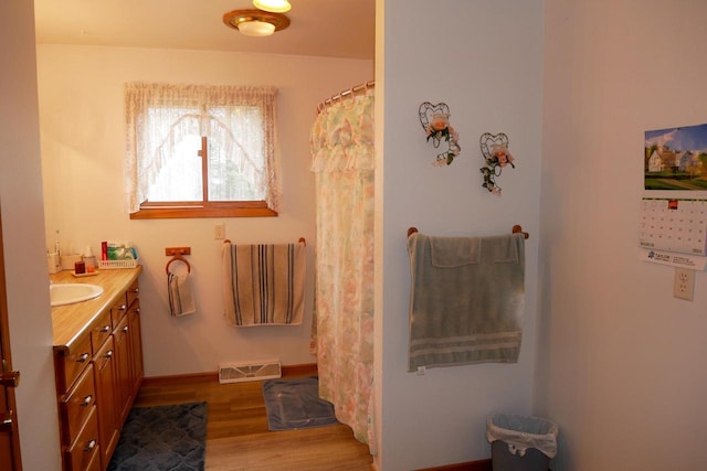 bathroom featuring vanity and hardwood / wood-style flooring