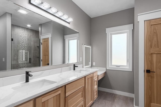 bathroom with vanity and walk in shower