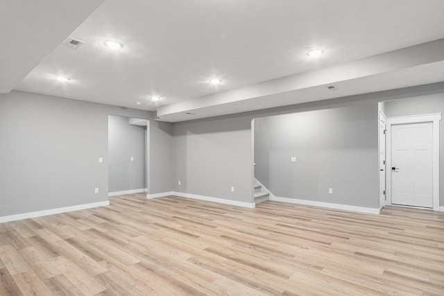 basement featuring light wood-type flooring