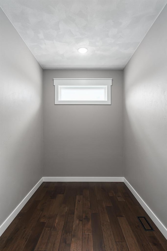 spare room featuring dark hardwood / wood-style floors