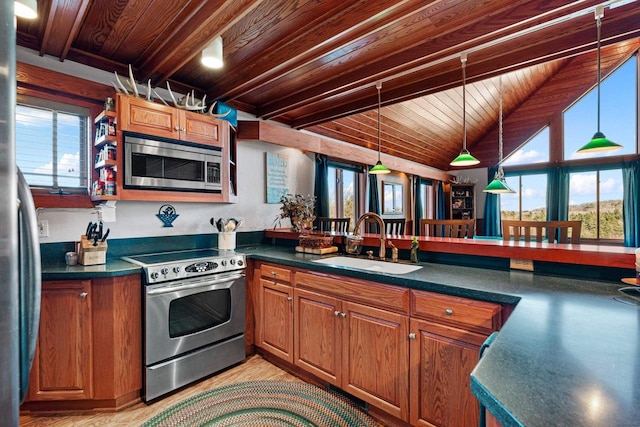 kitchen with wooden ceiling, appliances with stainless steel finishes, vaulted ceiling with beams, and sink