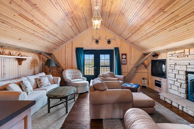 living room featuring wooden ceiling, wood walls, french doors, dark hardwood / wood-style floors, and a fireplace