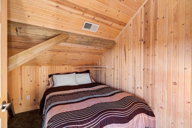 unfurnished bedroom with wood ceiling, wood walls, and vaulted ceiling