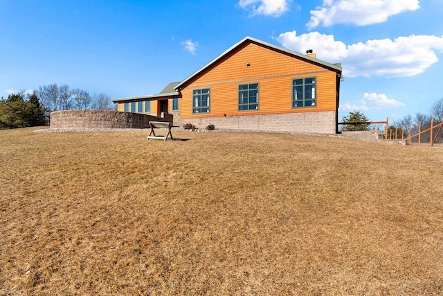 rear view of house with a lawn