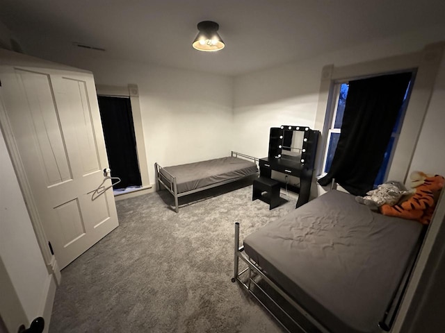 bedroom with dark carpet