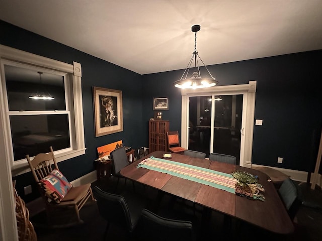 dining room featuring an inviting chandelier and built in shelves