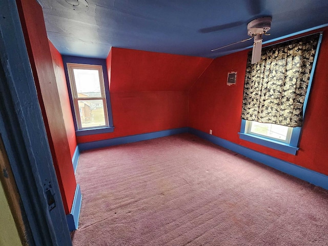 additional living space featuring carpet floors and lofted ceiling