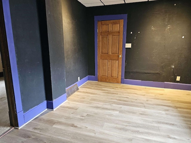 spare room featuring light hardwood / wood-style floors