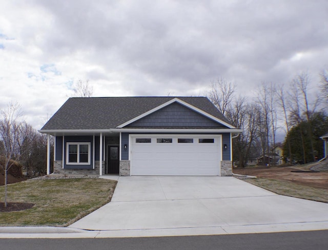 view of front of house with a front lawn and a garage