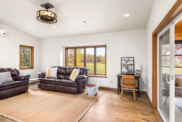 living room featuring light hardwood / wood-style flooring and lofted ceiling