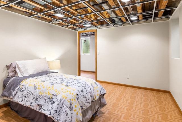 bedroom with light parquet floors