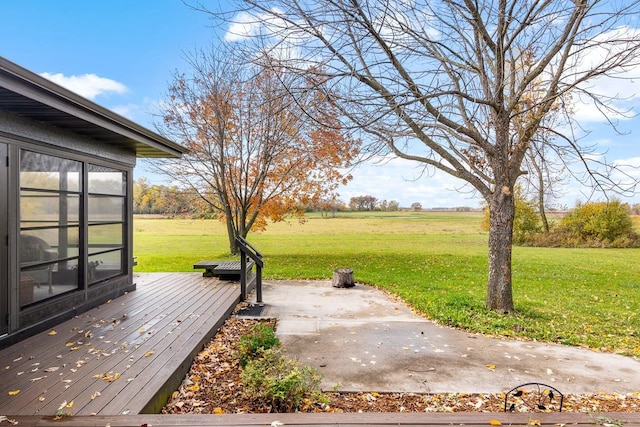 wooden terrace with a lawn