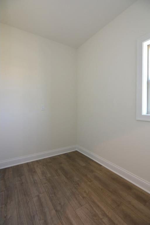 spare room featuring dark hardwood / wood-style floors