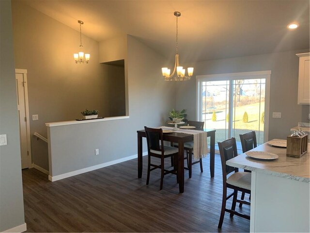 kitchen with dishwasher, white cabinets, sink, a kitchen island, and dark hardwood / wood-style flooring