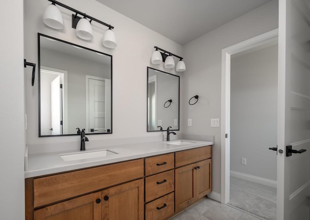 bathroom featuring tile patterned flooring and vanity