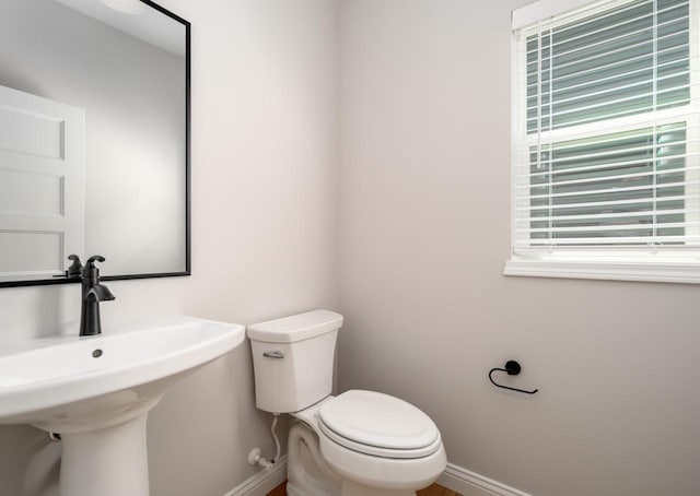 bathroom with toilet and sink