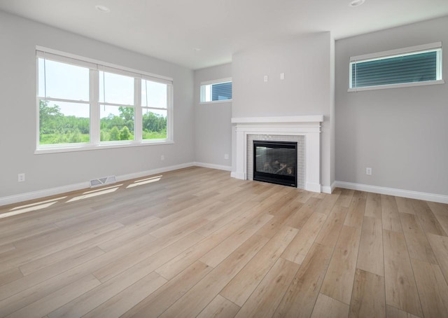 unfurnished living room with light wood-type flooring