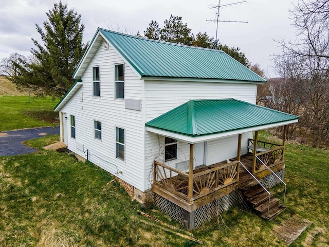 27751 Nutmeg Rd, Elroy, WI 53929 - rear view of property with a lawn, metal roof, and covered porch