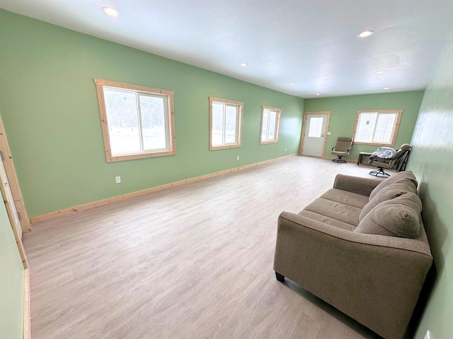 living room featuring light hardwood / wood-style flooring and plenty of natural light