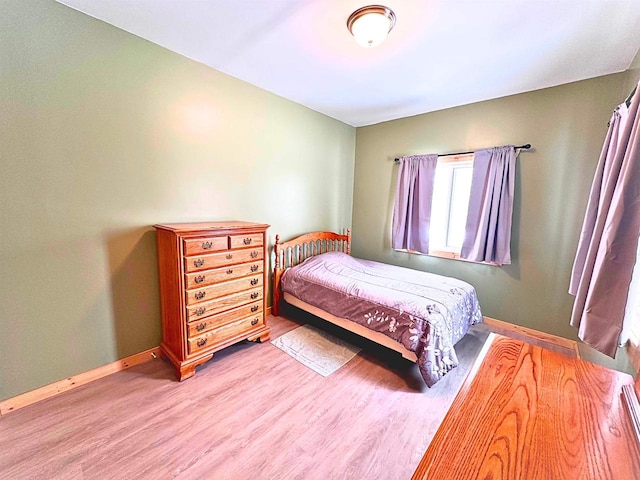 bedroom featuring hardwood / wood-style floors