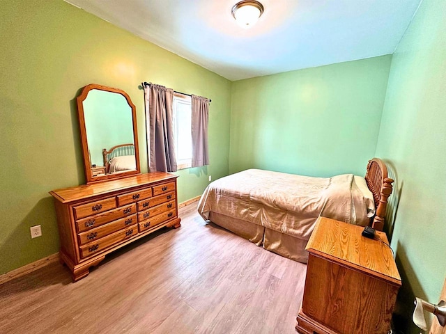 bedroom with light wood-type flooring