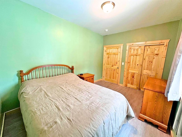 bedroom featuring hardwood / wood-style flooring