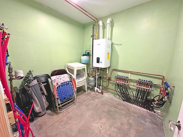 utility room featuring water heater