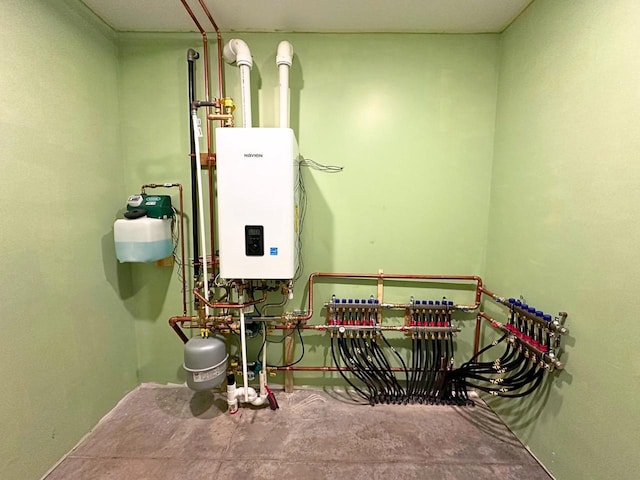 utility room with tankless water heater