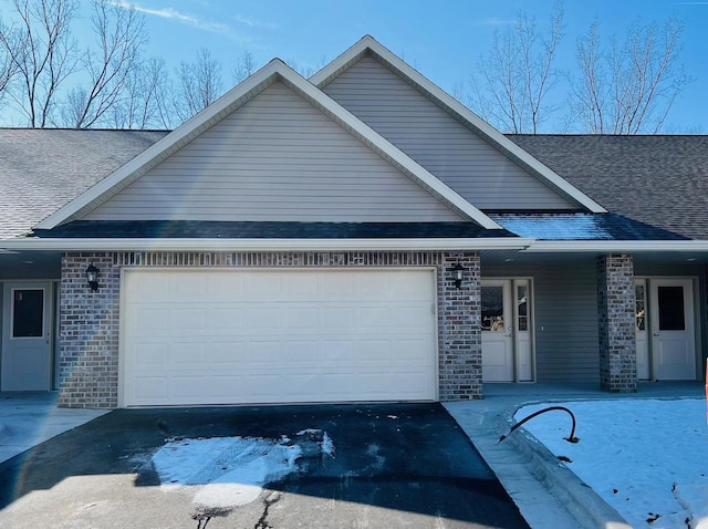 view of front of property featuring a garage