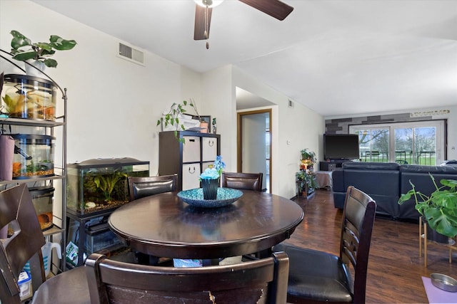 dining room with ceiling fan and dark hardwood / wood-style floors