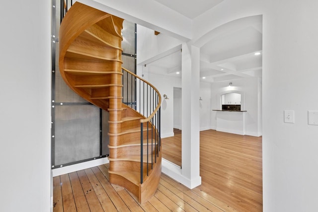 staircase featuring hardwood / wood-style floors