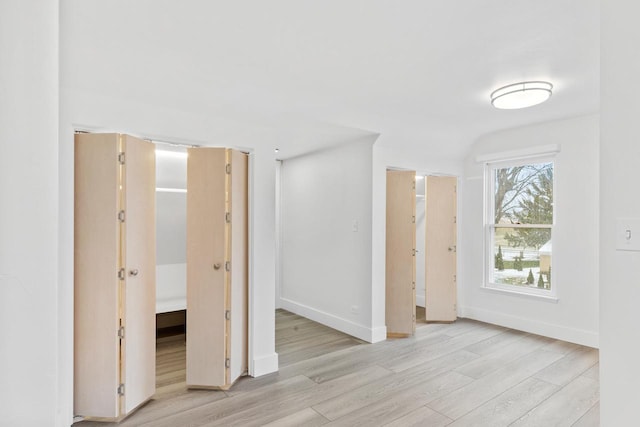 unfurnished bedroom featuring light wood-type flooring