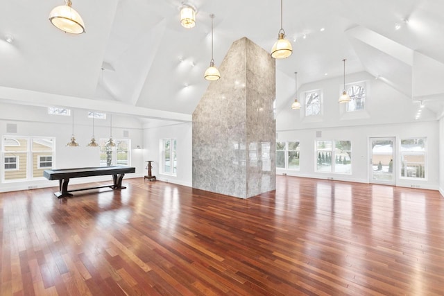 interior space featuring high vaulted ceiling, hardwood / wood-style floors, and billiards