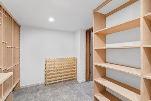 spacious closet with tile flooring