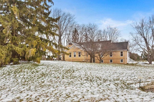 view of snow covered house