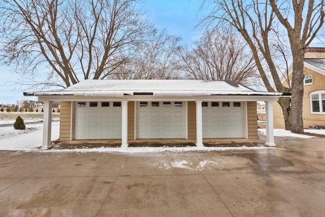 view of snow covered garage