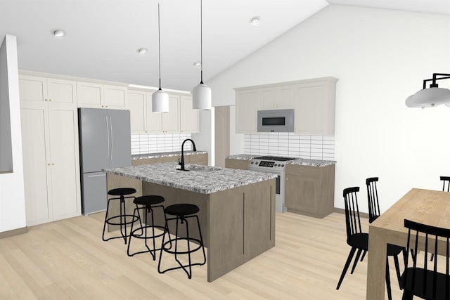 kitchen featuring white appliances, sink, backsplash, light hardwood / wood-style floors, and a center island with sink