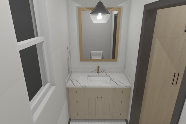 bathroom featuring toilet and vanity