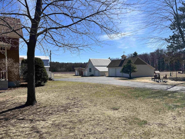 3367 County Road Y, Custer, WI 54423 - view of yard with driveway and a garage
