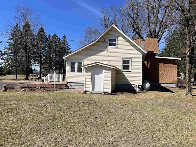 3367 County Road Y, Custer, WI 54423 - back of house with a deck, a lawn, and a chimney