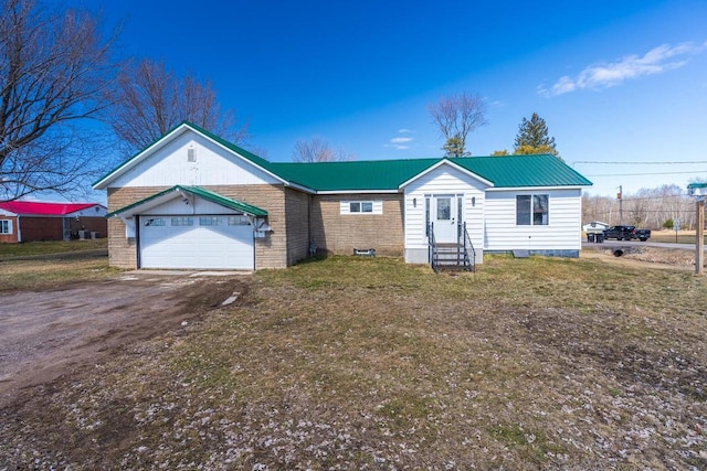 single story home featuring a front lawn and a garage