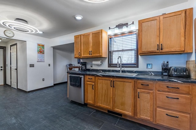 kitchen with stainless steel dishwasher, dark tile floors, and sink