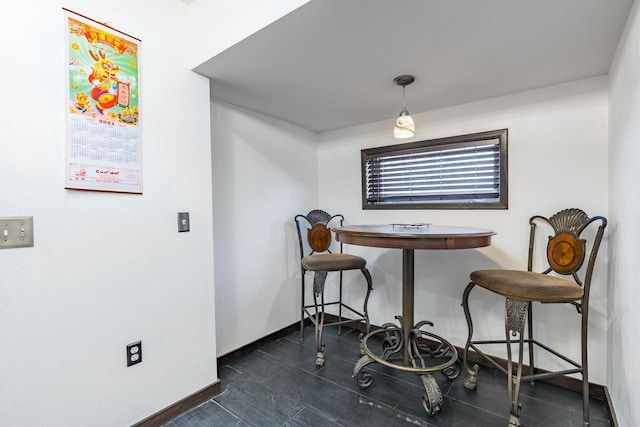 dining space with dark wood-type flooring