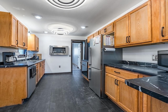 kitchen with stainless steel appliances, dark hardwood / wood-style floors, and sink