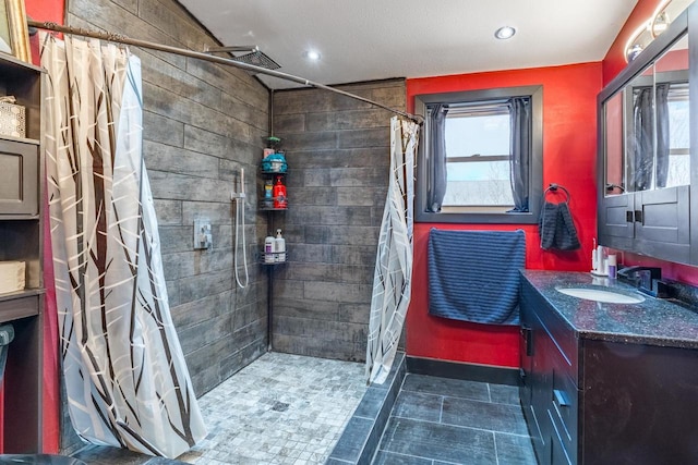 bathroom featuring tile floors, a shower with shower curtain, and vanity